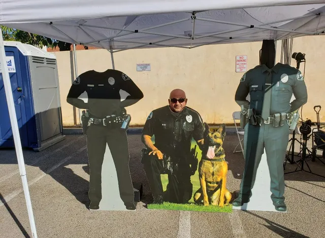A cardboard cutout of a police officer and his dog