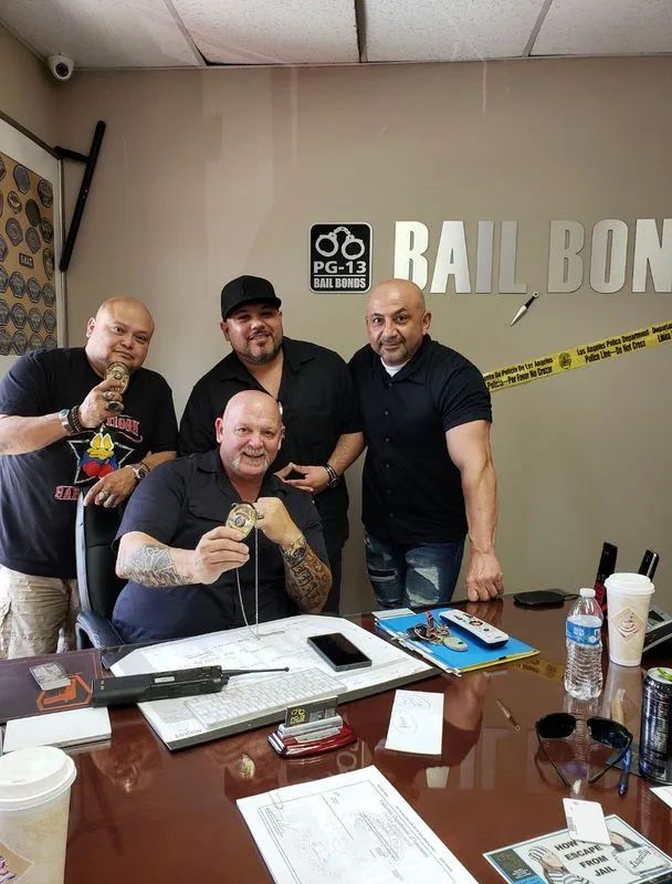 A group of men are posing for a picture in a conference room.